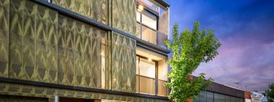Sapphire anodised a number of custom perforated screens and trims that form the exterior movable privacy screening of a two street facade that brings this development upscale and sets a new benchmark for the area of residential development in North Melbourne.